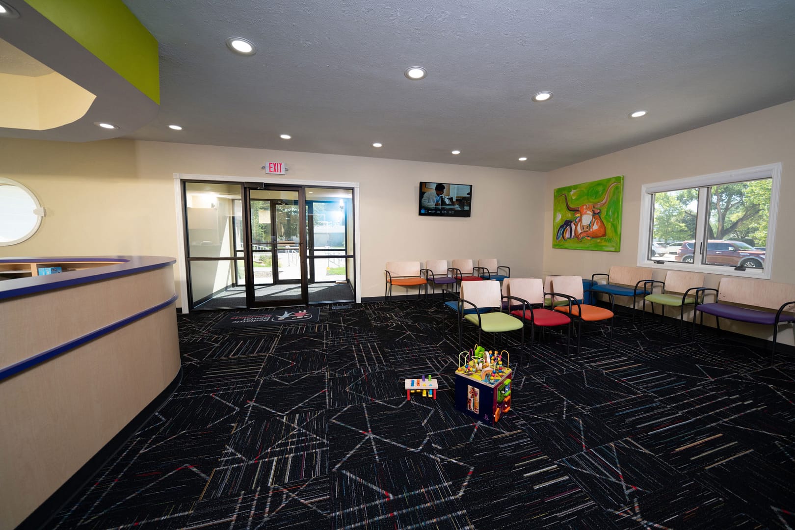 office lobby and reception area with seating and toys