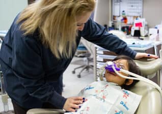 team member working with a young patient
