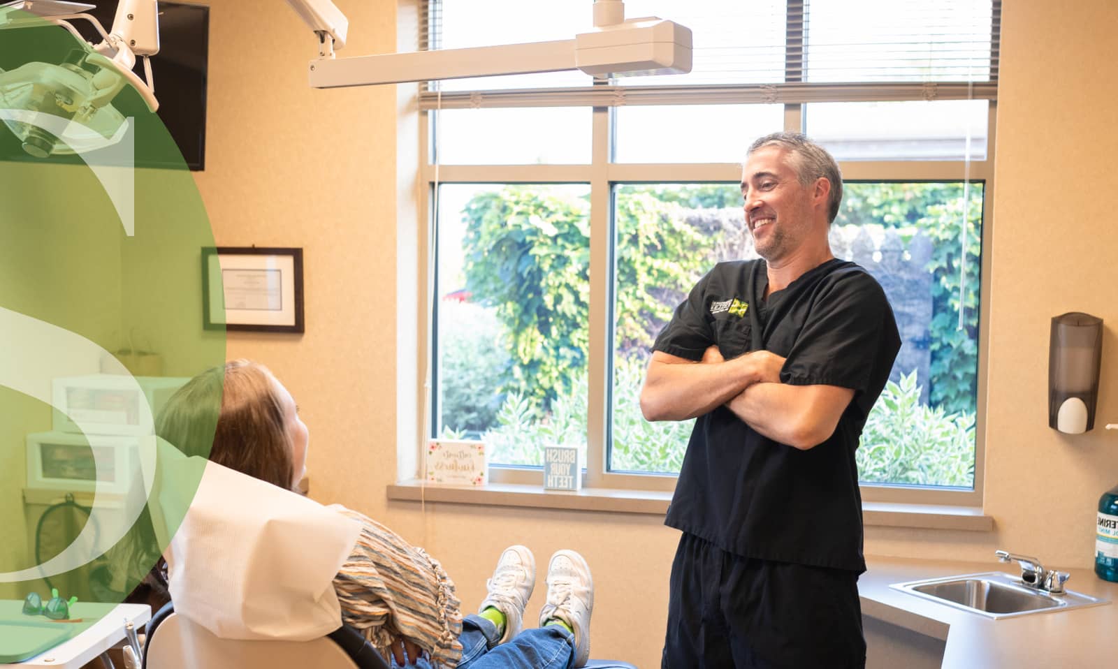 Dental insights from Dr. Jeff Feiock; Dr. Feiock speaking with a patient in this image