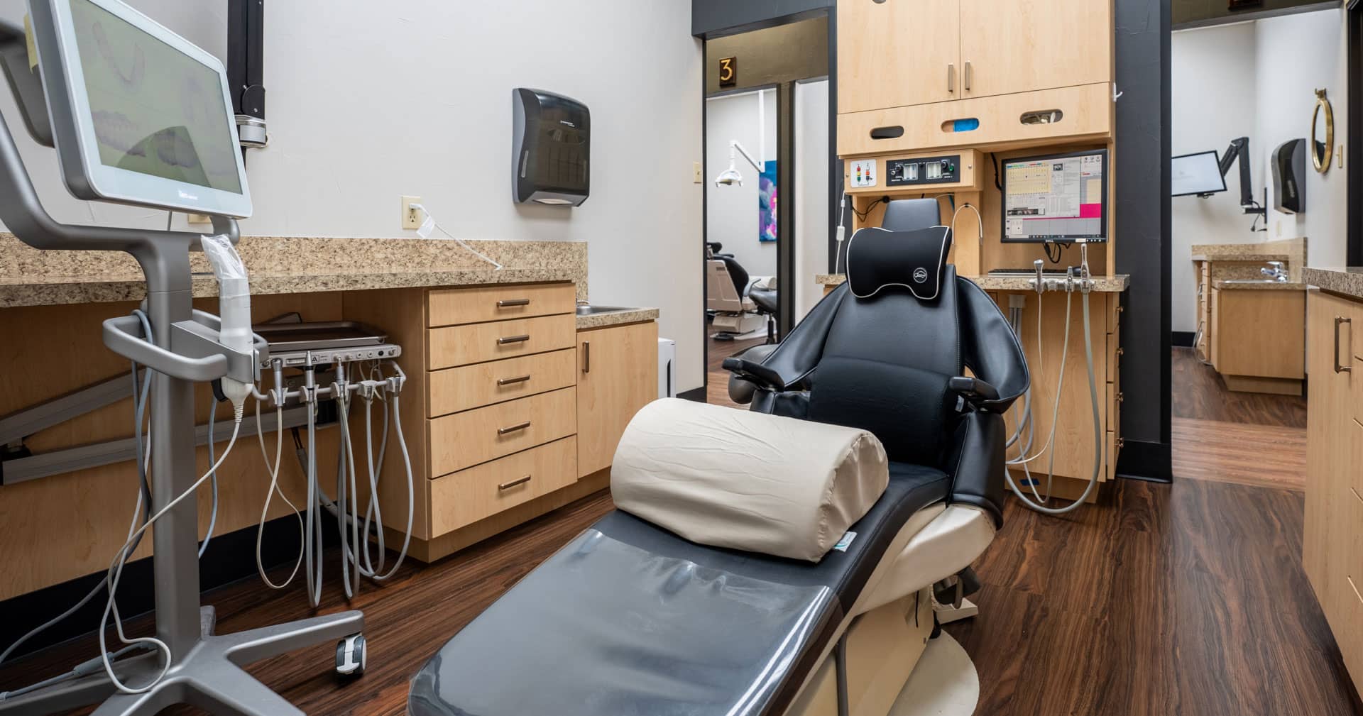 exam room with dental chair and equipment