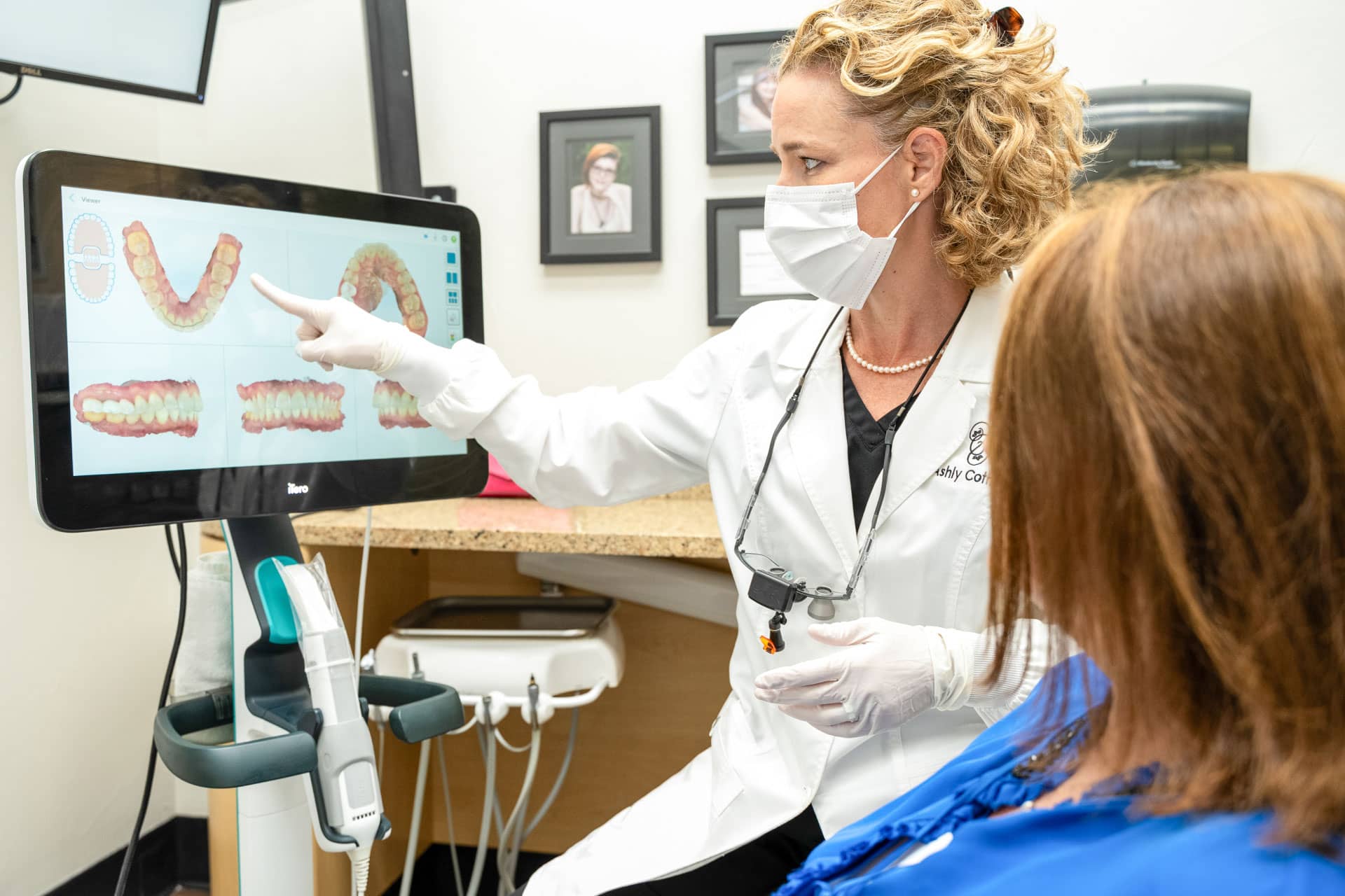 Dr. Cothern looking at dental images with female patient