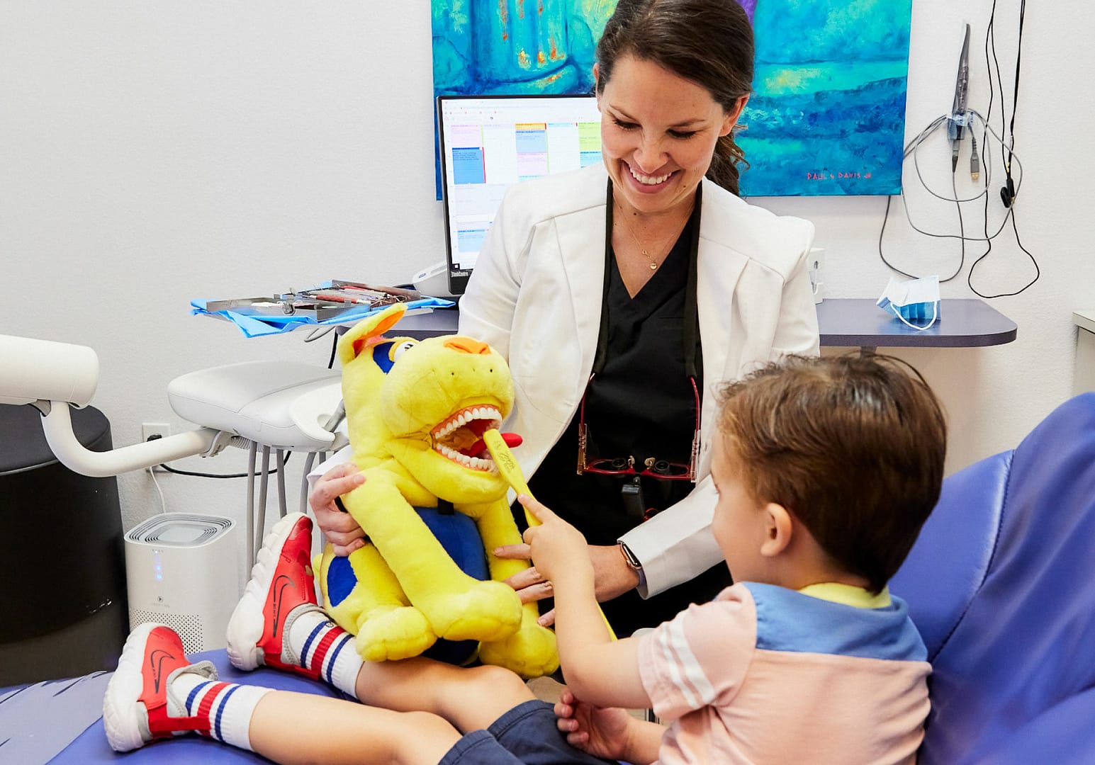dentist with pediatric patient