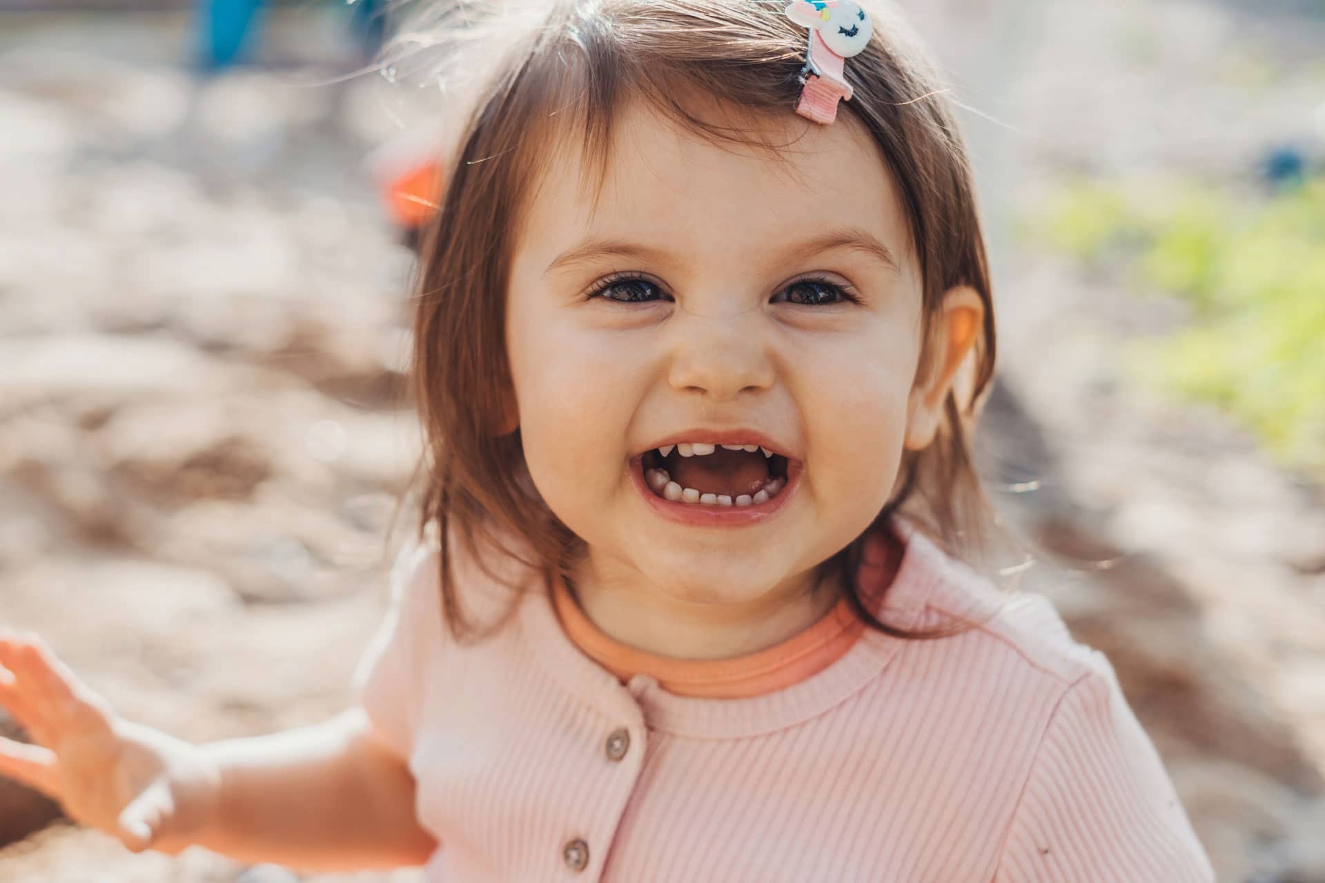 caucasian toddler girl smiling at camera
