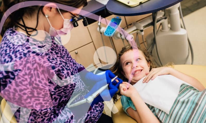 team member working with a young patient