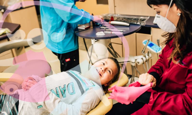 doctor working with a young patient