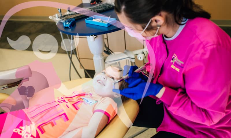 team member working with a young patient