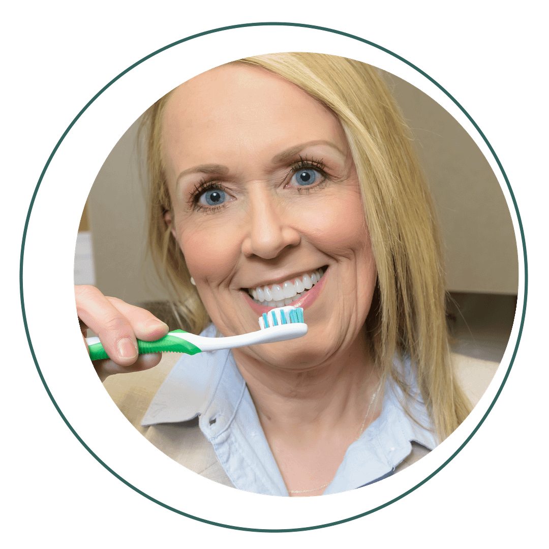 happy female patient brushing teeth