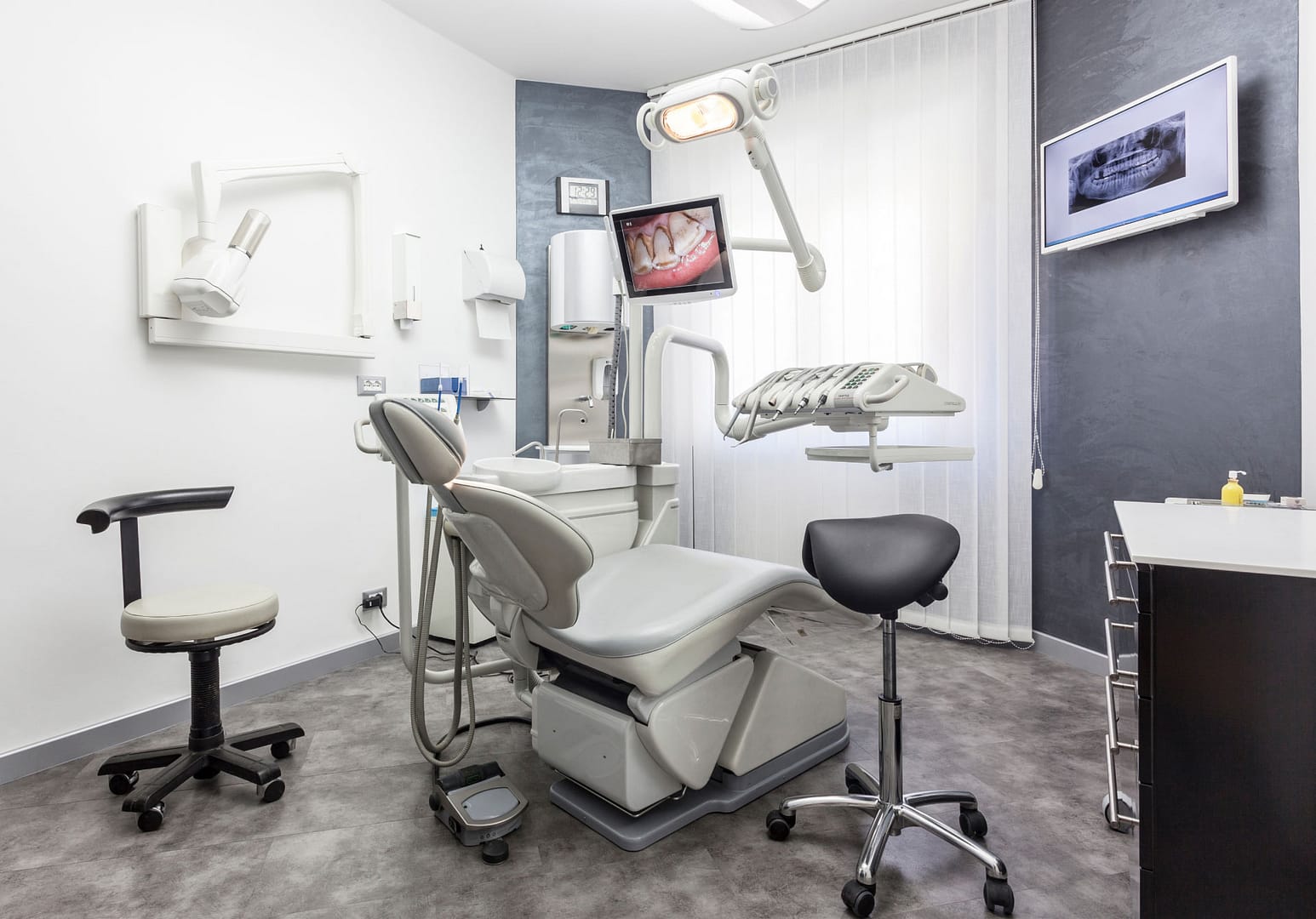 dental exam room with chair and equipment