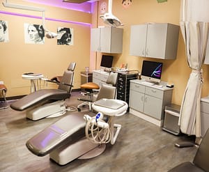 orthodontics room with dental chairs and star wars pictures on the wall