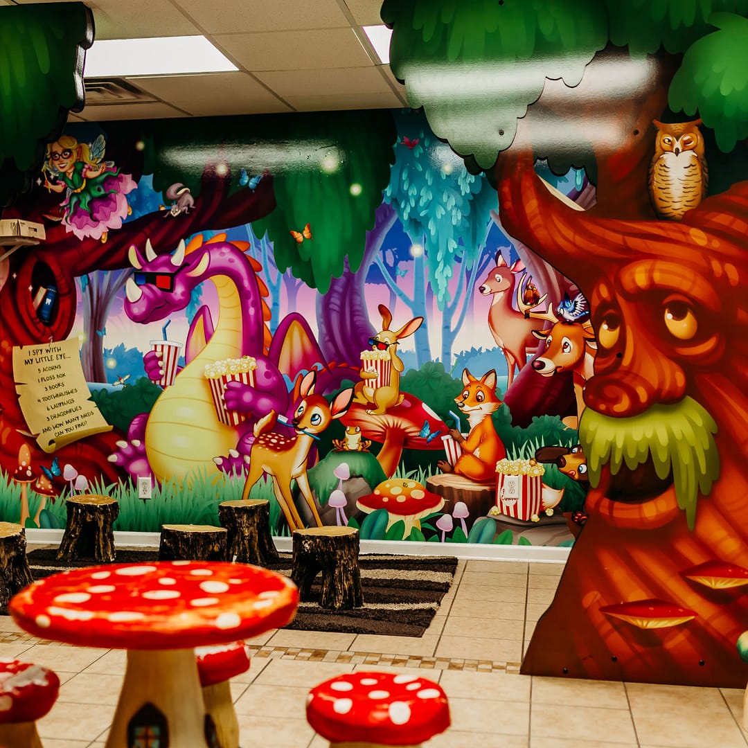 children's play area with fairy tale wall mural and mushroom table and stools