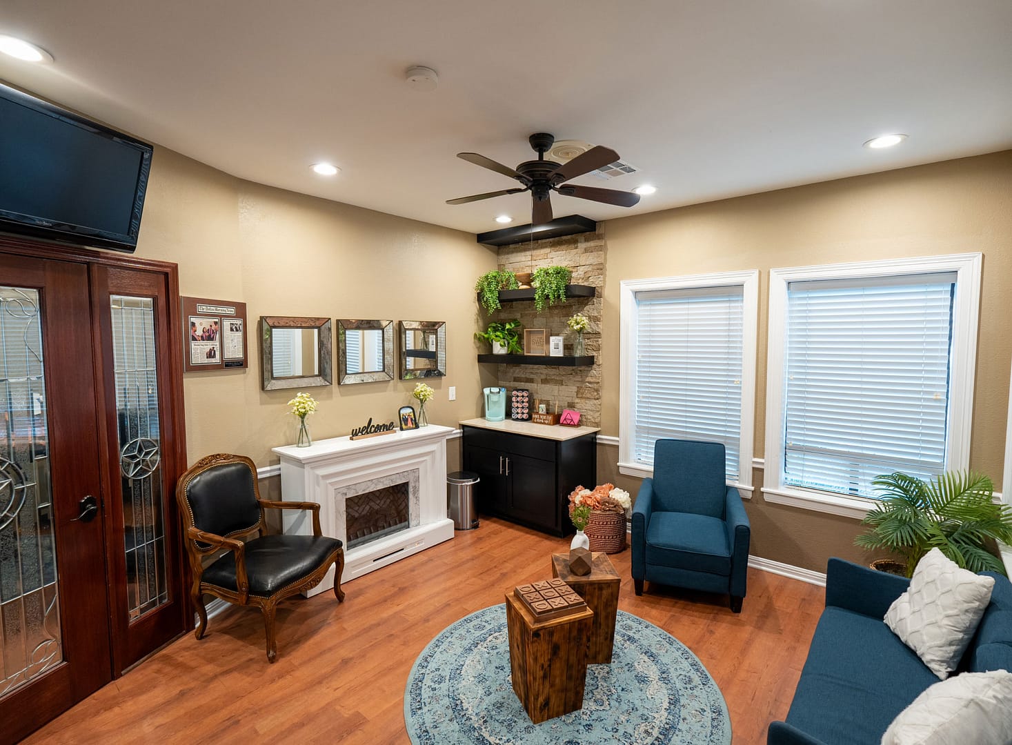 reception area with seating and fireplace