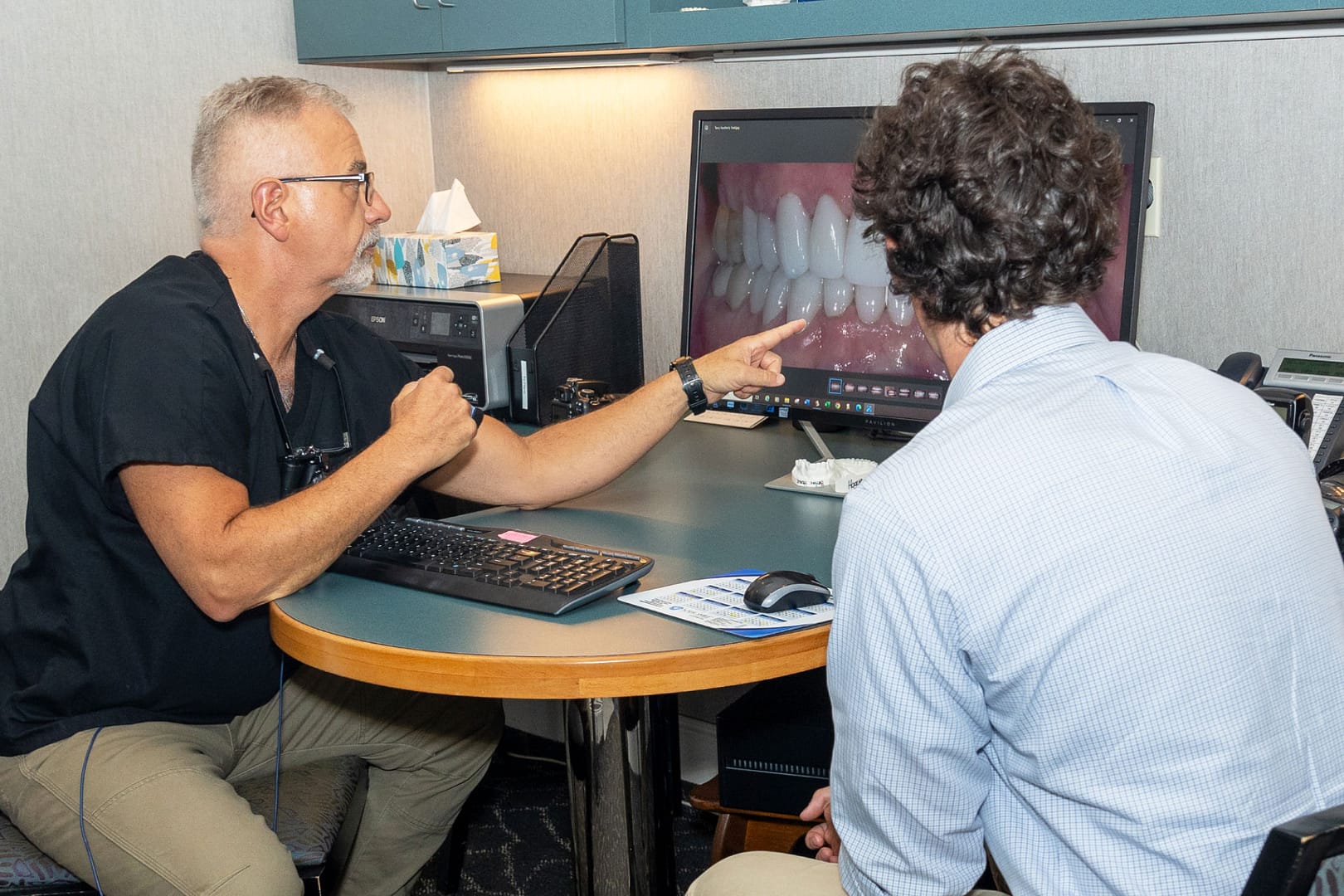 dr. goodman showing dental image to patient