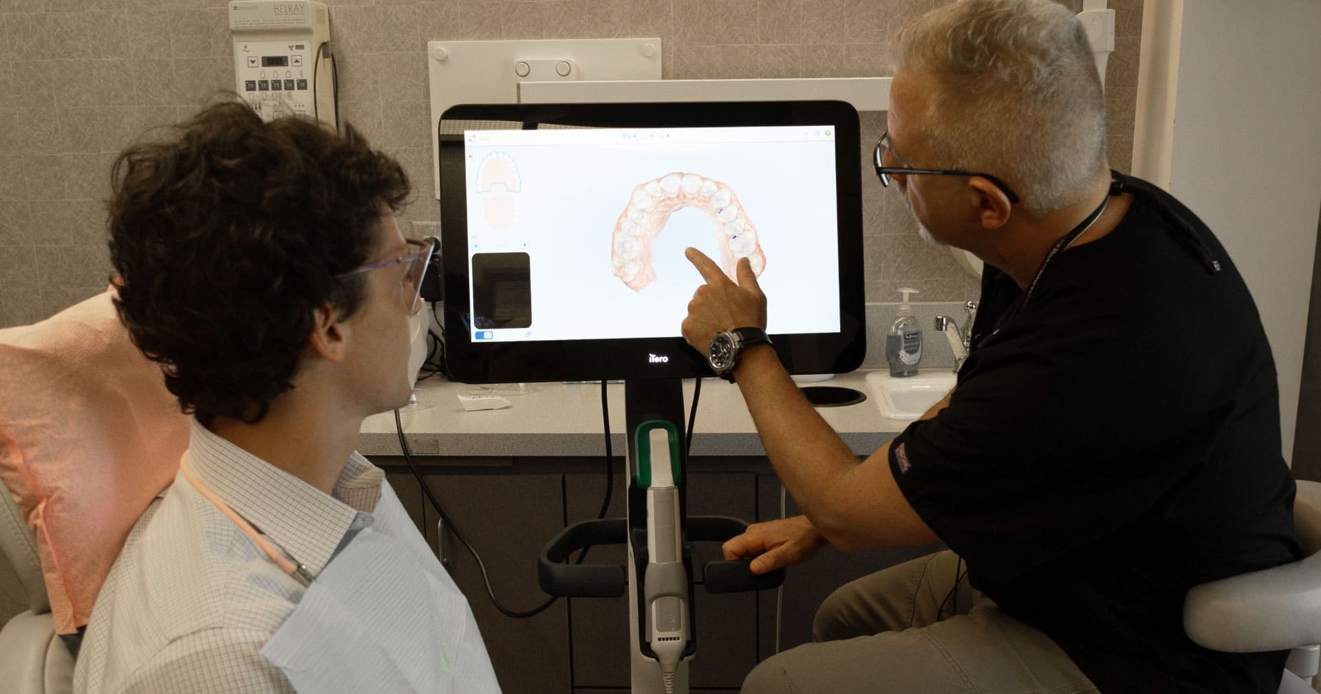 dr. goodman showing dental image to patient