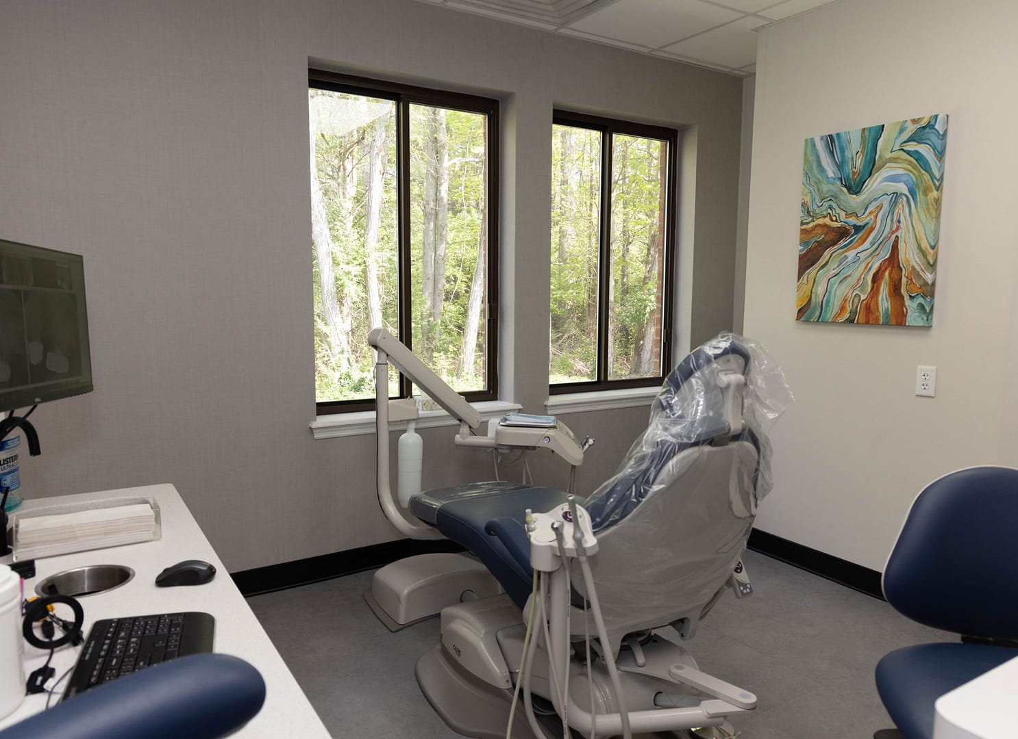 exam room with dental chair facing windows