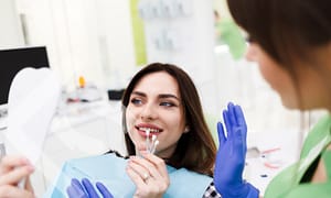 Dental bonding vs. veneers