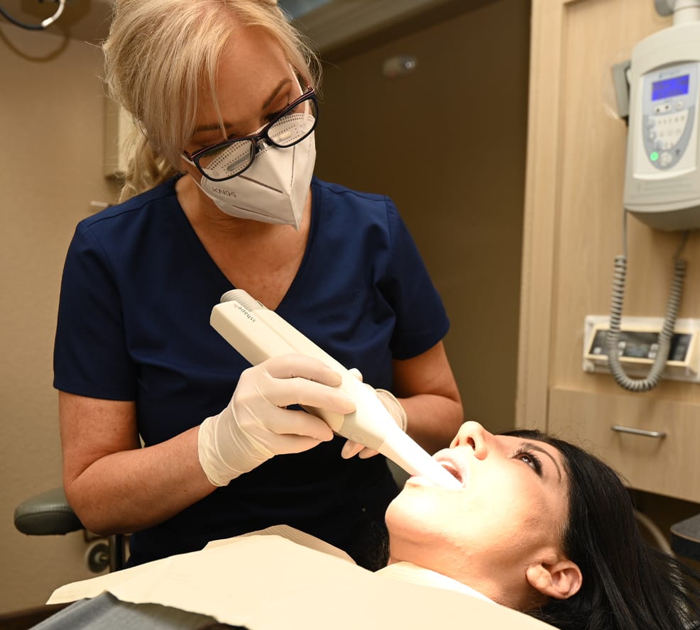 hygienist working with patient